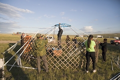 Farmers build a yurt for the annual festival Naadym (pronounced Nah-Dim) in Tos Bulak. The festival is an important element of today's Tuvan identity and includes various competitions such as the Best Yurt, horse racing, arching, wrestling and cooking contests. During Soviet era, Naadym as well as other Tuvan traditions were largely banned.