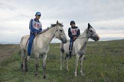 Brothers Salgyn, 14, and Kheimer, 13, Dongak prepare for the annual 15-km horse race as part of Naadym farmers' festival. Both Salgyn and Kheimer have been jockeys since the age of 8. Race rules allow neither saddles nor helmets. "If we wore them, we would be laughed at", the brothers said.