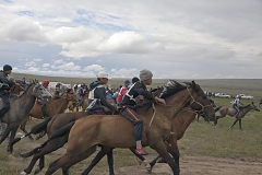 Start of the 15-km horse race as part of the annual farmers' festival Naadym. Rules allow neither saddles nor helmets. Boys can become jockeys since the age of 6.