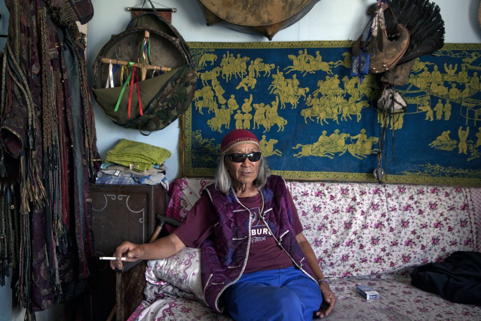 Nikolay Öorzhak, a shaman, in his Kyzyl office. Trained as a stage designer in Moscow, he later served as art director of the Tuvan National Theater in Kyzyl. In 1990, he founded the first shaman community in Tuva. "You can understand shamanism only if you become a shaman yourself. Shamanism is not a religion", he says, "it is a foundation of all religions. God is the energy of the universe, all else - Buddha, Christ - are just images". Mr Oorzhak says he receives many Western visitors, mostly psychologists.