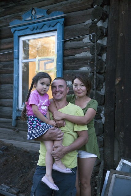 Filipp (41) and Shonchalay (37) Kozenyuk with their daughter Daria pose for picture in front of their house in central Kyzyl - the Tuvan capital. More than a 100 years since Tuva first became a Russian protectorate and even more years since first Russian settlers began penetrating in the isolated Tuva, mixed marriages are still a rare sight here. Filipp was born in Hungary, the son of a Soviet army officer. Trained as a psychologist in Moscow, he worked as a chef at a Japanese restaurant in the Russian capital where he met Shonchalay, a native of a Tuvan village who failed her exams at a Moscow university but stayed on and went to work as a waitress at that Japanese restaurant (in early 2000s, these establishments hired mostly 'Asian-looking' Russian minorities including Tuvans, Kalmyks, Buryats and Yakuts). Filipp's parents were not really happy with his marriage (because of Shonchalay's origin) until a story that happened to them some years later. Filipp was invited by a friend to work as a chef in Goa, India, where he then opened his own food joint but then got involved in some semi-legal activities, was jailed for a few months, then released on bail and fled India with a forged passport, first going to Nepal, then Tibet, China, and finally finding himself in Mongolia from where he was helped by Shonchalay's Mongolian relatives to illegally cross the Russian-Mongolian border in Tuva. The couple and their two kids have finally settled in Kyzyl ever since. Of Russian-Tuvan interethnic relations Shonchalay recalls that during late Soviet era, most Tuvans faced daily discrimination at almost every step - from getting jobs and housing to buying bus tickets or being served at shops - except for the very top positions in the regional government, most well-paying jobs were held by ethnic Russians and the capital Kyzyl was considered a "Russian" city - rural Tuvans being kept away. When the Soviet economy collapsed, Tuva's Russian community has shrank significantly, and this discrimination is now long gone although tensions can still be felt. Ethnic Russians and Tuvans form two distinct communities that rarely mix up and only interact out of necessity.