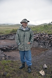 Konstantin V. Chugunov, an archaeologist with the State Hermitage Museum in St. Petersburg, posing for picture in front of a burial mound being excavated by an expedition he leads in the so-called Valley of Kings in northern Tuva. Mr Chugunov has dedicated almost his entire career to exploring the ancient monuments of Tuva. In 2003, he and Hermann Parzinger of the German Archaeological Institute in Berlin have discovered here a rich burial of a noble Scythian, his wife and guards with thousands of golden and other paraphernalia. The largest part of the discovery is displayed at the National Museum of Tuva in Kyzyl, a smaller part - at The Hermitage Museum in St. Petersburg.