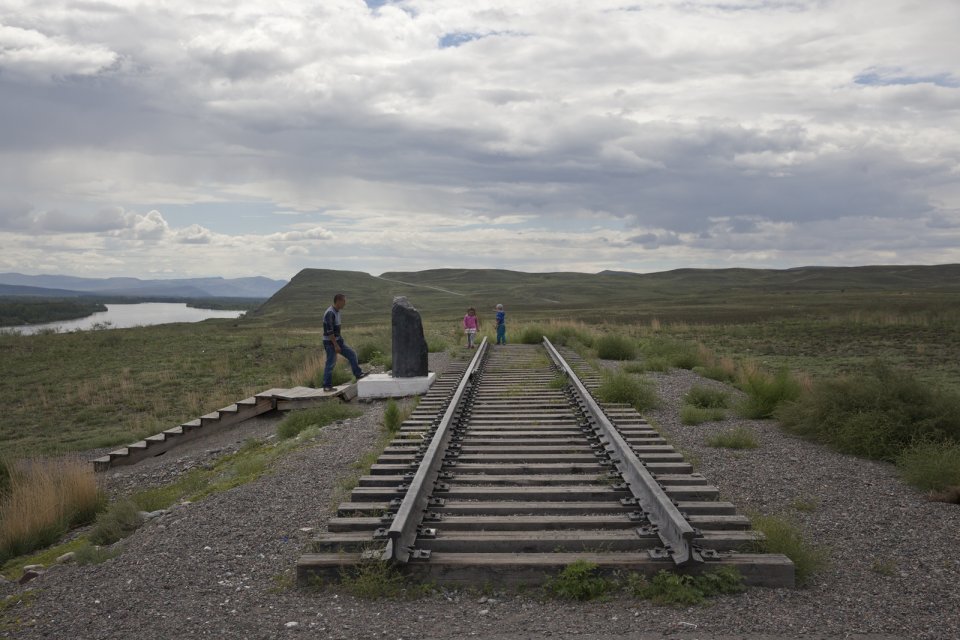 A father and his kids inspect the "first" rail track section and a foundation stone outside the Tuvan capital Kyzyl where its future railway station is supposed to sit. Tuva had never had any railways. A rail link that would connect Tuva with the southern branch of the Transsiberian Railway has been designed and approved by the Russian government in 2007 but the project has never really taken off ever since due to doubts about its cost-effectiveness.