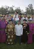 Tuva deputy governor Anatoly Damba-Khuurak (center, in white) posing for picture with Russian and Mongolian sports officials (in folk costumes) and this year's khuresh wrestling champions (above)