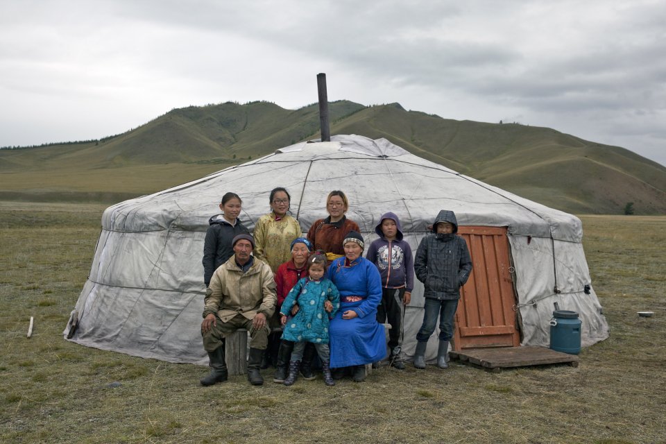 Shimitsi Khumbun, 79 (center, in red, with granddaughter Sanchira on her knees) was born and has been living in the Kachyk river valley for her entire life, she has 16 children (of which two live next to her to help her and are present in the picture - Robert to her left and Maya to her right), about 90 grandchildren and 19 great grandchildren. Standing from left to right Mrs Khumbun's grandchildren Angarmaa, Buyana, Gazhidmaa, Sanchay, and Nachyn.