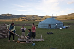 Bayir-Kys Banchyk and Valentina Sambyr demonstrate the traditional way to tan cowhide which is then used to make shoes, as youngsters look on. Such crafts survive only in such isolated communities as this one in Kachyk river valley in southeastern Tuva.