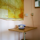 Карта Западной Сибири и старый телефон в одной из лабораторий