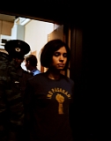 Member of Pussy Riot Nadezhda Tolokonnikova being escorted by police from the court on July 4, 2012