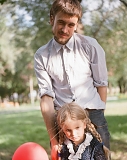 Petr Verzilov, activist and husband of Nadezhda Tolokonnikova with their daughter Gera in a park in front of the Moscow City Court on July 9, 2012, after the court extended the arrest of all three members of Pussy Riot.