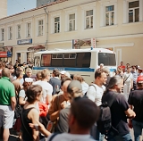 A crowd of supporters and opponents of Pussy Riot as well as media and a police bus near Tagansky Disctrict court in Moscow on July 4, 2012